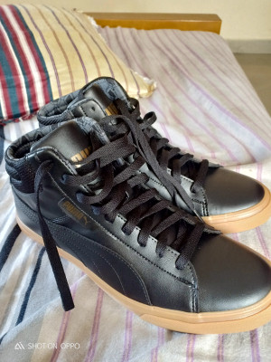 Puma grip mid deals idp black sneakers