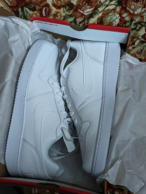 Nike ebernon low vs air force 1 top