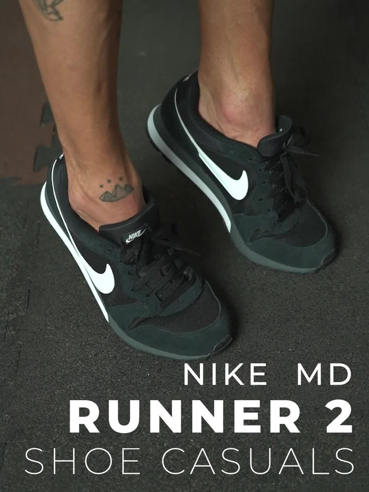 nike md runner on feet