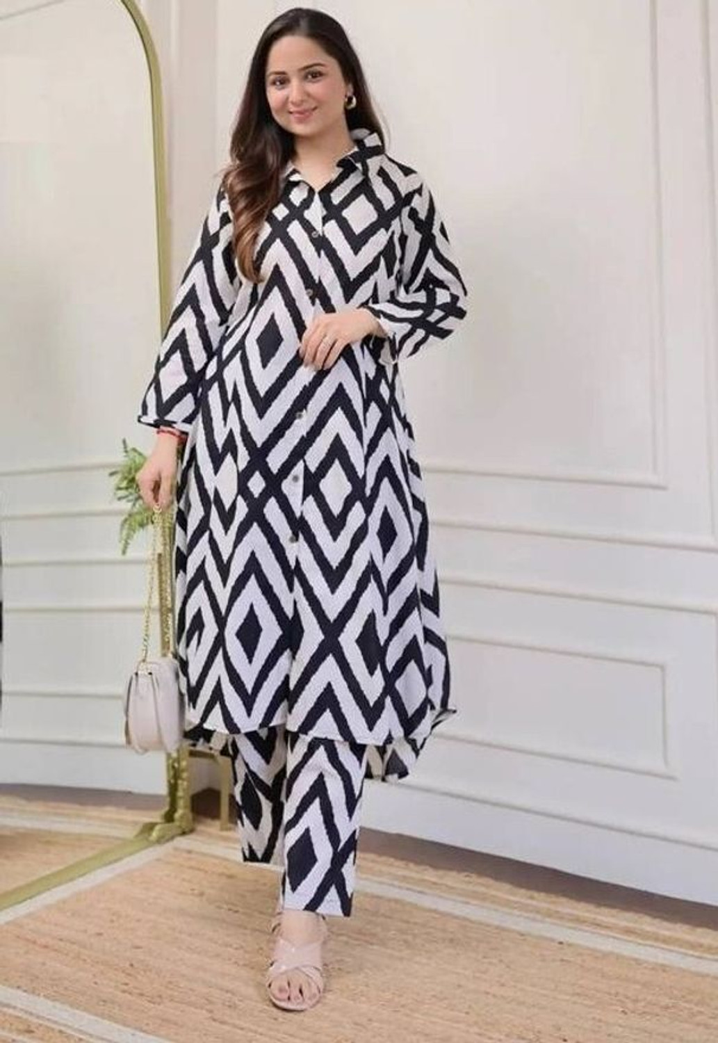 Image of NKRM Solid Viscose Rayon Flared Kurta for Women (Black)