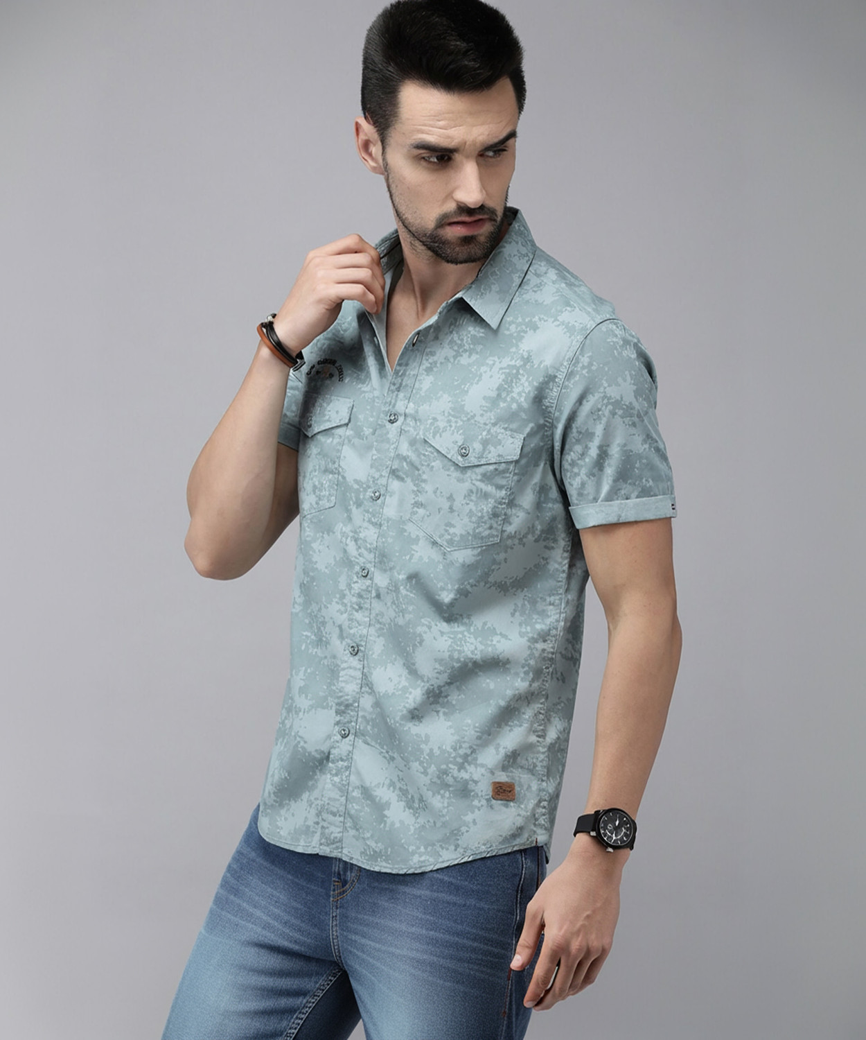 Image of Roadster Men Regular Fit Solid Spread Collar Casual Shirt