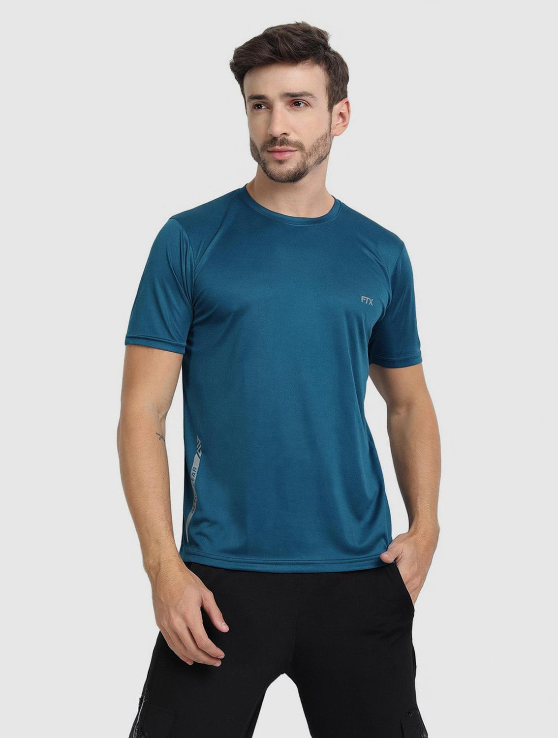 Image of Roadster Men Solid Round Neck Pure Cotton Green T-Shirt
