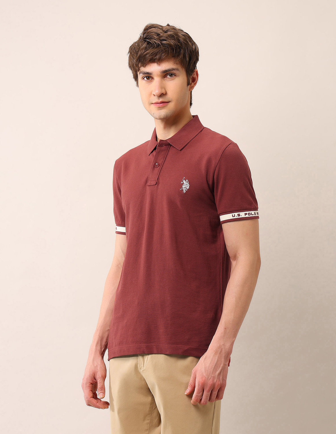 Image of U.S. Polo Assn. Denim Co. Men Solid Polo Neck Pure Cotton Orange T-Shirt
