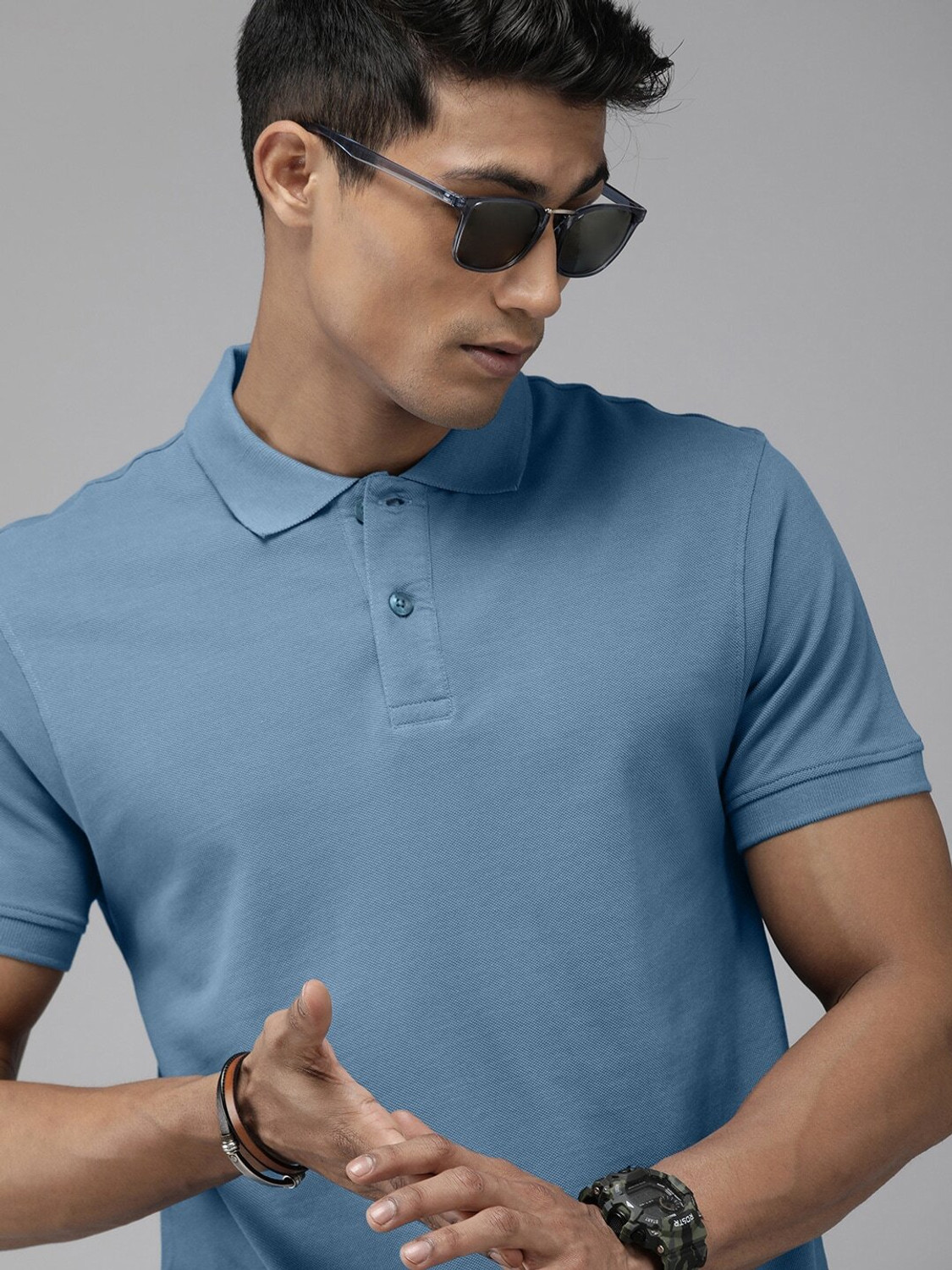 Image of Roadster Men Solid Polo Neck Pure Cotton Green T-Shirt