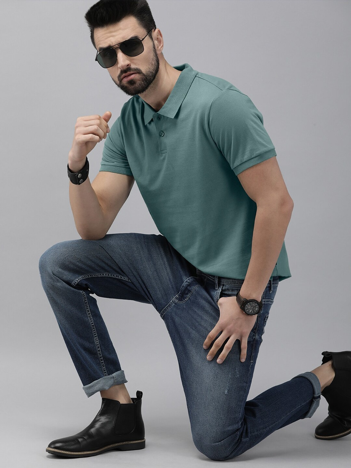 Image of Roadster Men Solid Polo Neck Pure Cotton Green T-Shirt
