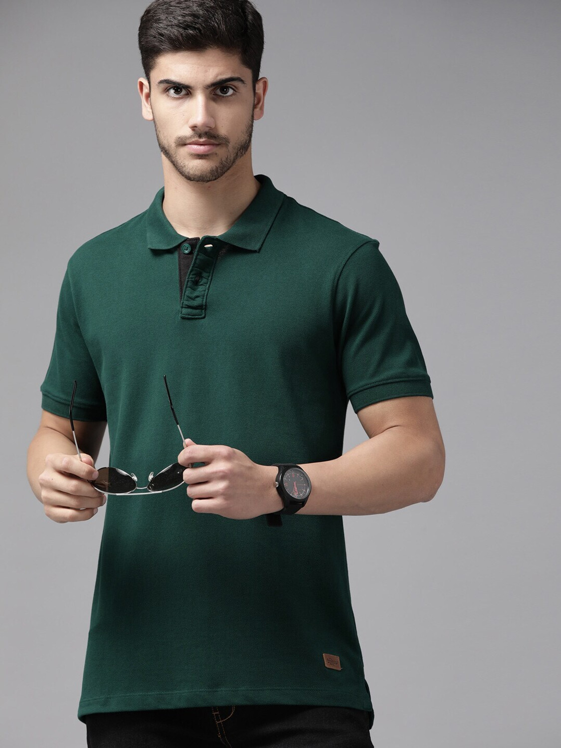 Image of Roadster Men Solid Polo Neck Pure Cotton Green T-Shirt