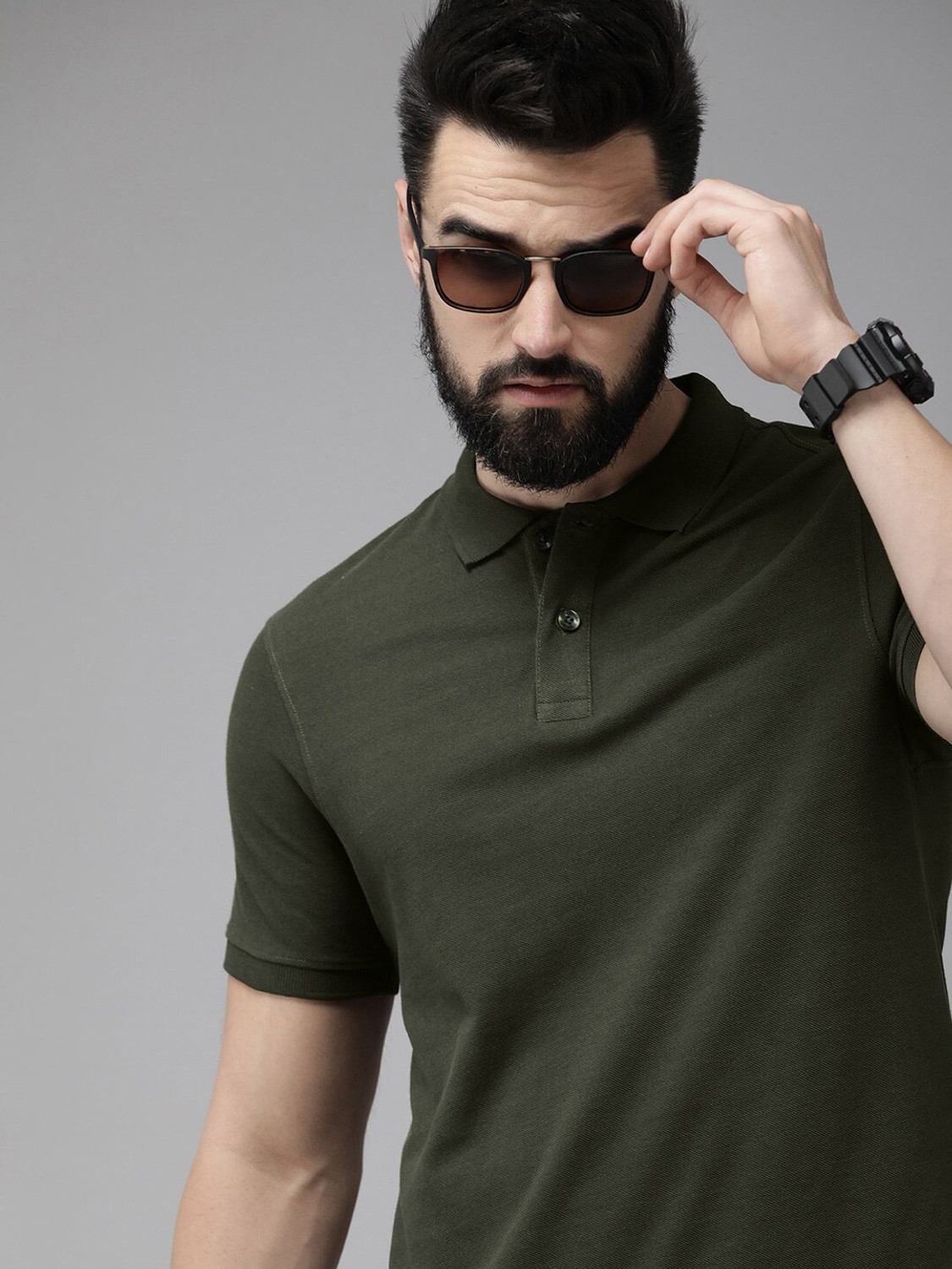 Image of Roadster Men Solid Polo Neck Pure Cotton Green T-Shirt