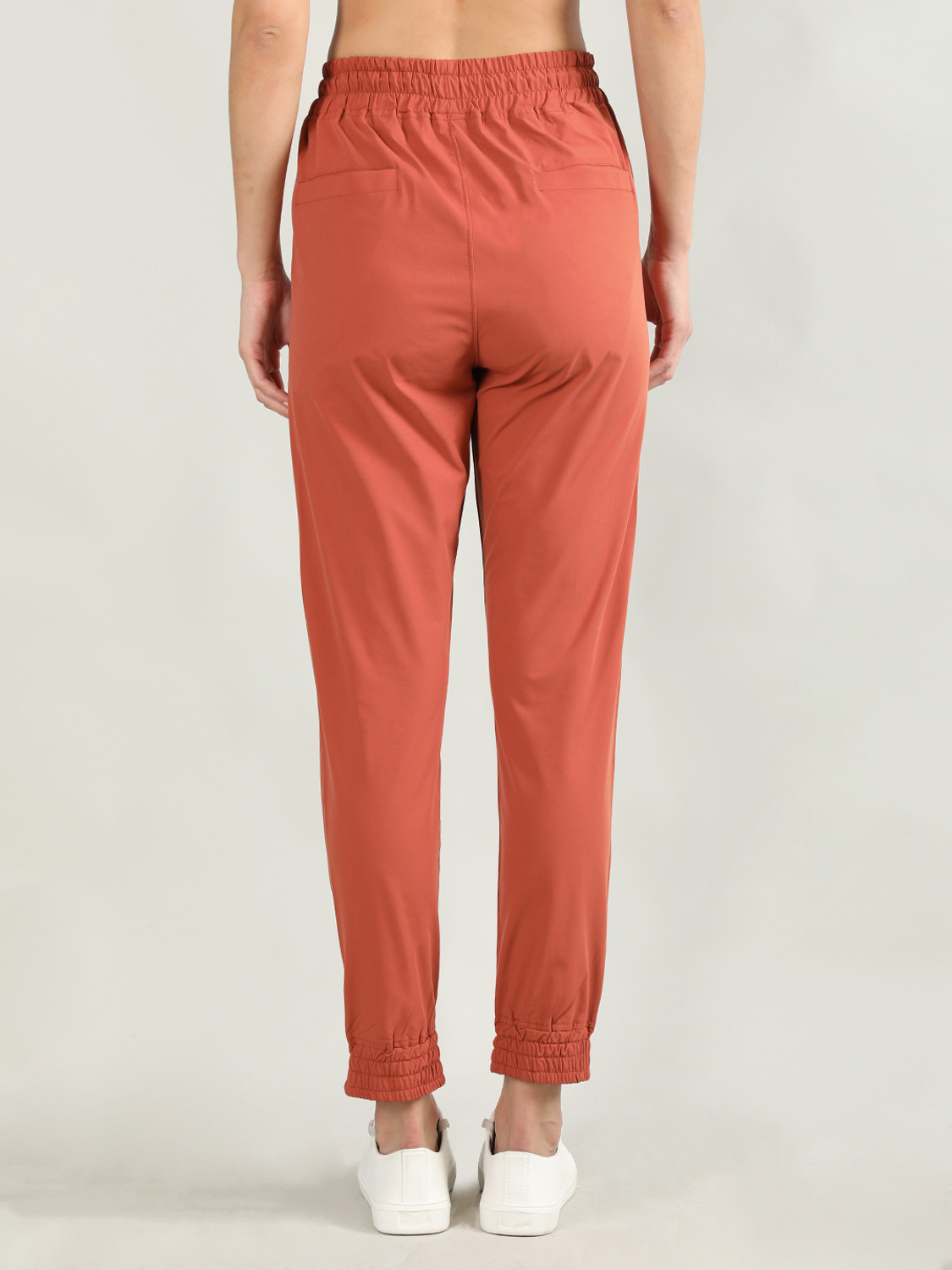 Image of CHKOKKO Women Solid Orange Track Pants