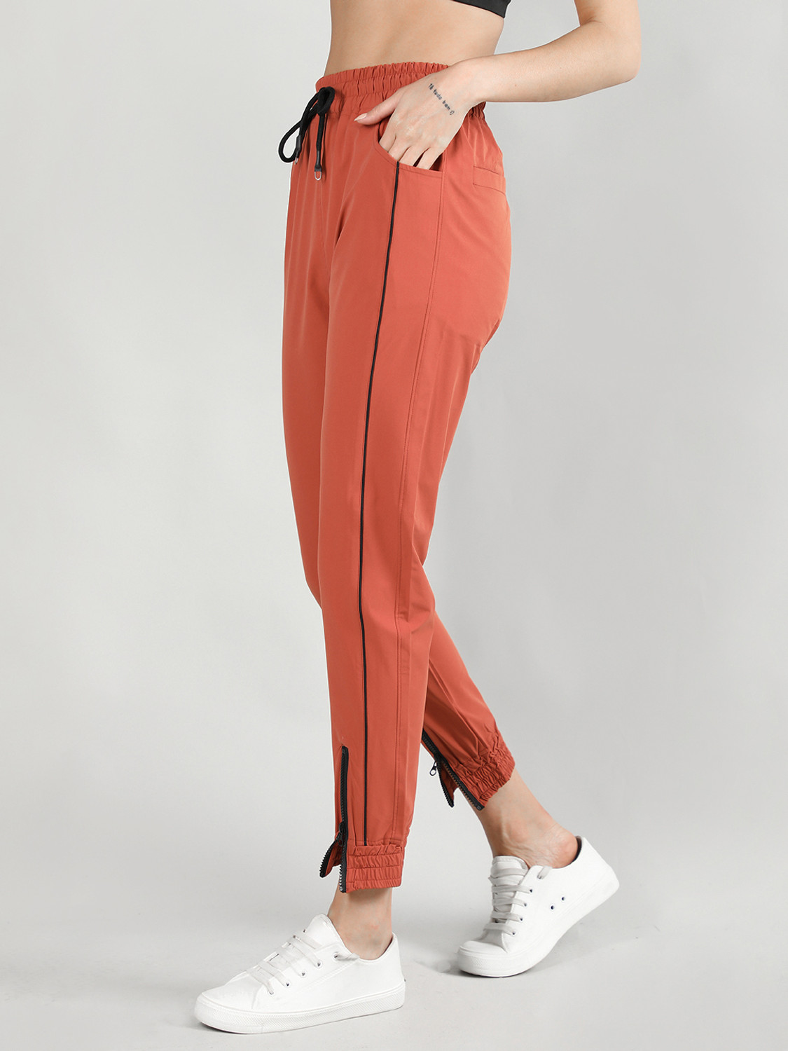 Image of CHKOKKO Women Solid Orange Track Pants