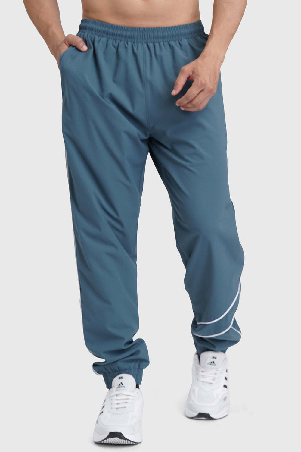 Image of FuaarK Men Solid Blue Track Pants