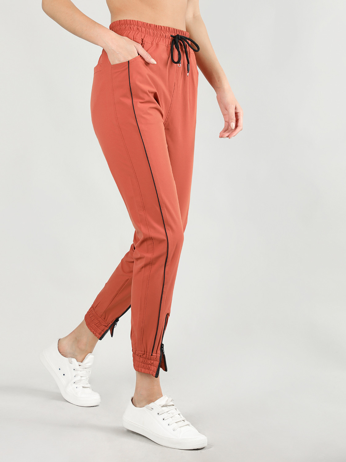 Image of CHKOKKO Women Solid Orange Track Pants