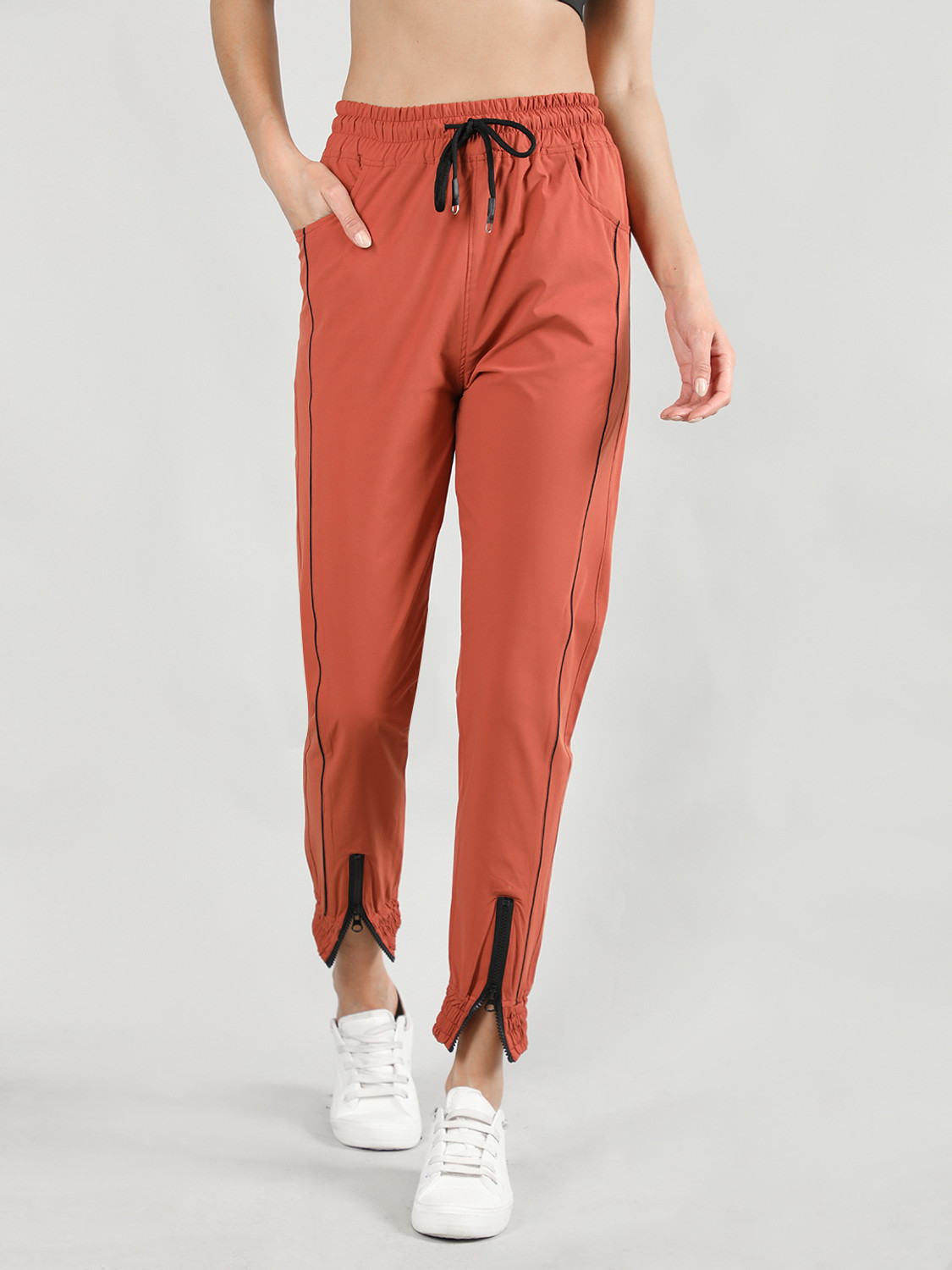 Image of CHKOKKO Women Solid Orange Track Pants