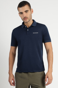 REEBOK Solid Men Polo Neck Blue T-Shirt