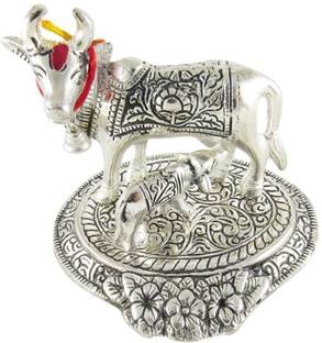 shoppingmart06 Mouse over image to zoom Have one to sell? Sell it yourself Kamdhenu Cow and Calf Showpiece - 13 cm (Aluminium, Silver, Red) Decorative Showpiece  -  10.5 cm