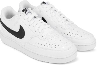 white nike shoes black tick