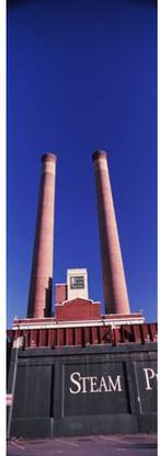 Low angle view of two smoke stacks at Steam Plant Square Spokane Washington State USA Canvas Art - Panoramic Images (18 x 6) Canvas Art