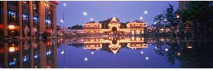 Buildings in an amusement park lit up at dusk Tivoli Gardens Copenhagen Denmark Canvas Art - Panoramic Images (18 x 6) Canvas Art