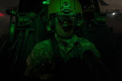 Pilot equipped with night vision goggles in the cockpit of an Apache helicopter Canvas Art - Terry MooreStocktrek Images (35 x 24) Canvas Art