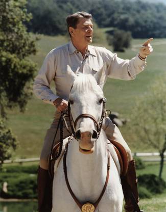 Digitally restored vector photo of President Ronald Reagan on horseback Canvas Art - John ParrotStocktrek Images (25 x 32) Canvas Art