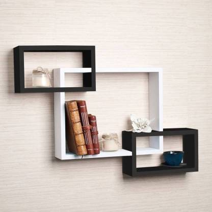 BT Decors Wooden Intersecting wall shelves set of 3 It includes 3 rectangle shaped units that are interlocked together to form one large piece. Once assembled, mount it on your wall to start placing your knick-knacks, picture frames, candles, and other trinkets on it. The simple and quick installation will have this shelf up in minutes. Place it on your living area, kitchen, or bathroom for a modern and sophisticated look. It will be a functional shelf but also a decoration to your house. Do not hesitate to get one. MDF (Medium Density Fiber) Wall Shelf