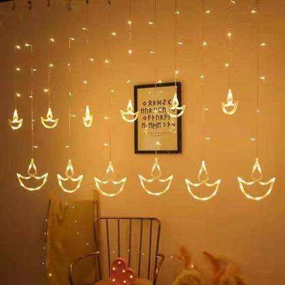 Balloonistics Diya Lamp Curtain Lights 12 Lamps 138 LED String Lights 8 Modes Diya Shaped Lights Plug in Curtain Lights for Bedroom, Wedding, Party, Christmas, Diwali Decorations for The Home LED Garland Pack of 1