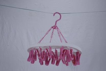 Pankhudi The 360 Degree rotatable clothes drying hanger rack can be rotated to any angle you want. The lockable hook prevents the hanging rack from falling down from your clothesline in winds. When taken down, it lays flat for easy storage. Wooden Cloth Clips