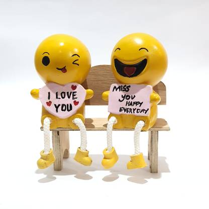 QUIRKY HOMEZ Cute Couple Emoji sitting on the wooden bench Set of two pieces (QH-0106) Decorative Showpiece  -  18 cm