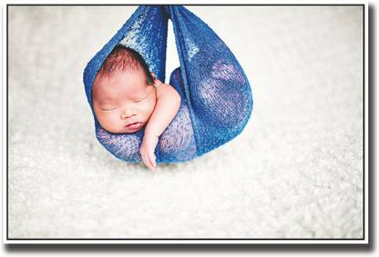 Baby sleeping in a blue swing Fine Art Print