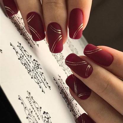 The NailzStation Golden Swirls Designer Fake Nails with glue application kit Maroon
