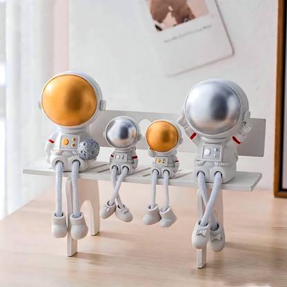 Elegant Lifestyle Astronaut Family Gift Set, Space Couple holding Objects Hanging Legs Statue Home Decorative Showpiece  -  14 cm