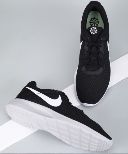 Womens nike black hot sale and white shoes