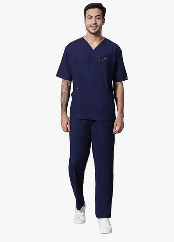 doctor blue dress Young female doctor in a blue medical uniform standing confidently with  crossed hands