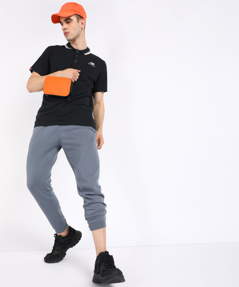 New Balance Solid Men Polo Neck Black T-Shirt Buy New Balance