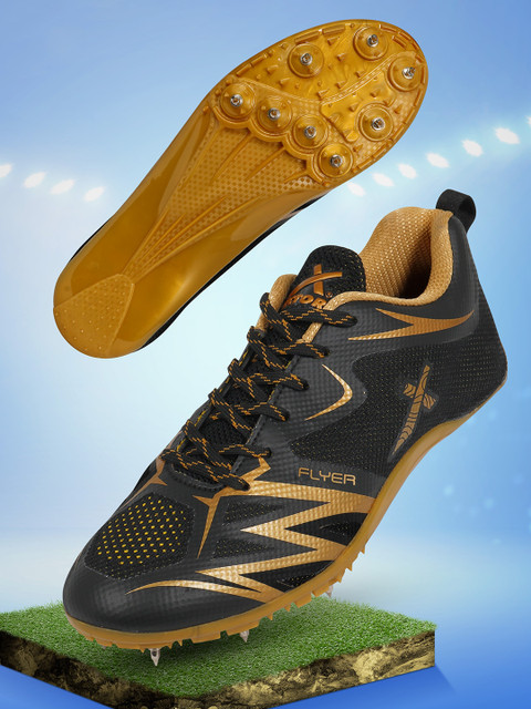 black and gold nike spikes