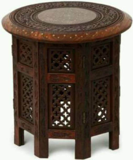 Unity Handicrafts Beautiful Design Round Shape Table For Living Room Size(LxBxH-12x12x12) Inch Home decor table help accentuate the style of your other living room furniture. Usually placed at the home it is a very important component of the overall look of your living room.Wooden table comfortable and durable. Made from seasoned mango wood with hand carved design, crafted by our craftsmen Living & Bedroom Stool