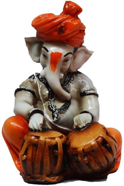 Flipkart SmartBuy Lord Ganesha playing Tabla Decorative Showpiece  -  12 cm