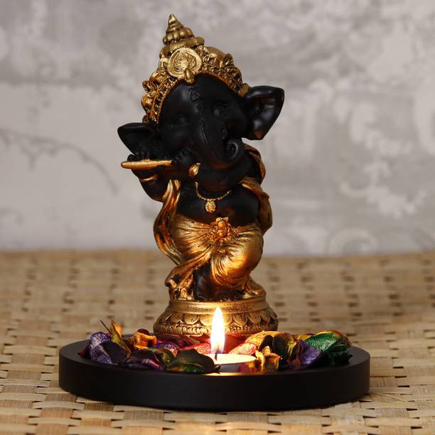 eCraftIndia Golden and Black Lord Ganesha Dancing Avatar Decorative with Wooden Base, Fragranced Petals and Tealight Decorative Showpiece  -  17.5 cm