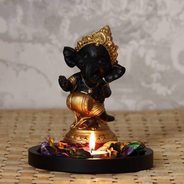 eCraftIndia Golden and Black Lord Ganesha Dancing Avatar Decorative with Wooden Base, Fragranced Petals and Tealight Decorative Showpiece  -  16.5 cm