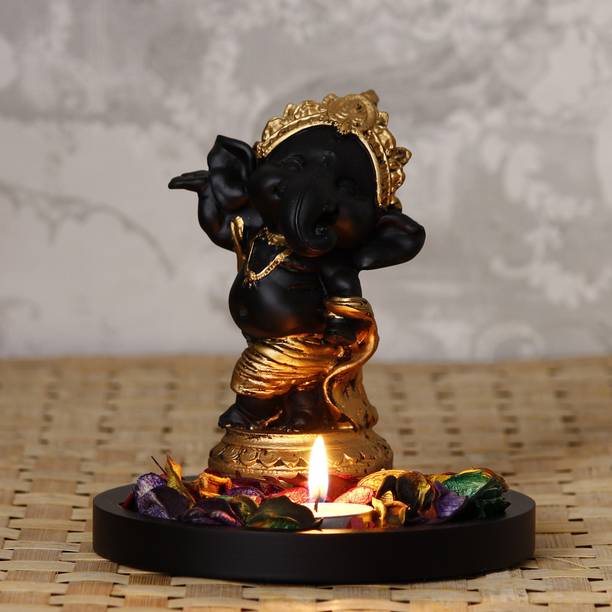 eCraftIndia Golden and Black Lord Ganesha Dancing Avatar Decorative with Wooden Base, Fragranced Petals and Tealight Decorative Showpiece  -  15.5 cm