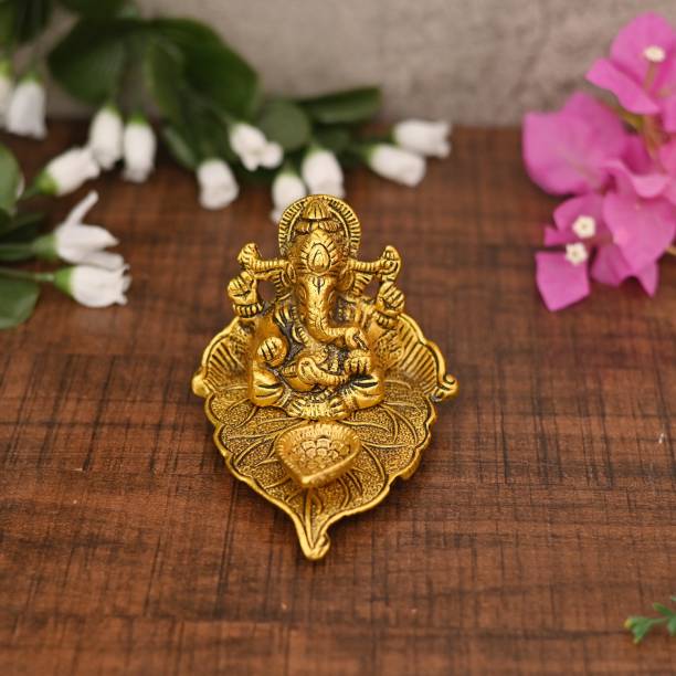 maviss fashion Ganesh Ji Sitting On Leaf With Diya Idol Decorative Showpiece  -  8 cm