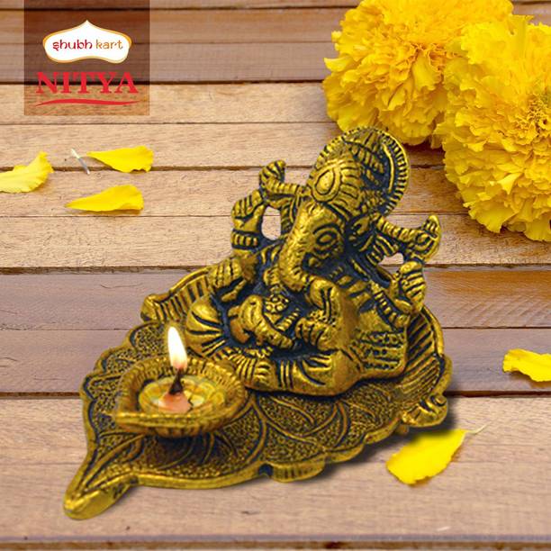 Shubhkart Nitya Ganesha on Paan Leaf With Diya- 138 g Decorative Showpiece  -  7.6 cm