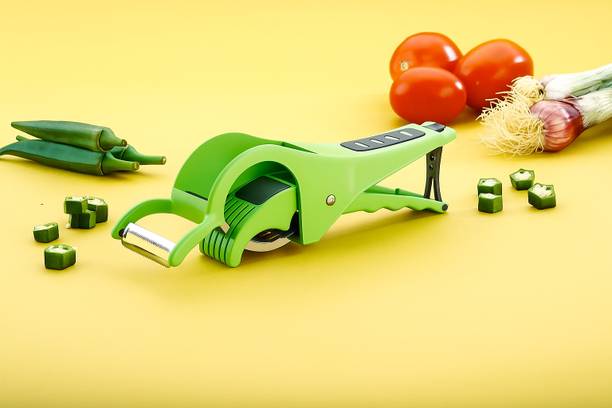 Shiva solution Multi-Functional Handheld Vegetable Cutter with Peeler – Green Vegetable & Fruit Slicer