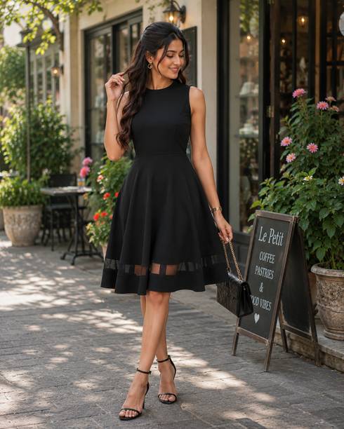 Woman comparing modern clothing options while building a wardrobe