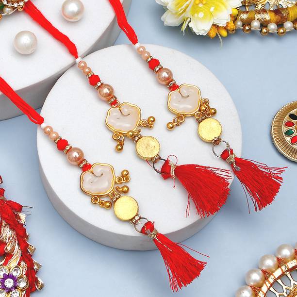 Lumba Golden Crimson Lumba Bhaiya Bhabhi Rakhi Set With Rakhi Greeting Card Assorted Rakhi, Greeting Card, Chawal Roli Pack Set by ARCHIES