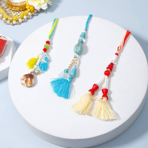 Thread Pack of 3 Beach Charm Lumba Rakhis For Bhabhi With Greeting Card Assorted Rakhi, Greeting Card, Chawal Roli Pack Set by ARCHIES