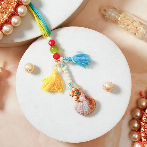 Thread Sea Shell Lumba Designer Bhabhi Rakhi with Rakhi Greeting Card Assorted Rakhi, Greeting Card Set by ARCHIES