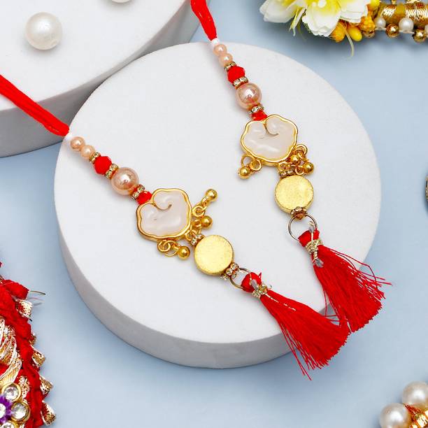 Lumba Golden Crimson Lumba Elegant Bhabhi Rakhi Set With Rakhi Greeting Card Assorted Rakhi, Greeting Card, Chawal Roli Pack Set by ARCHIES