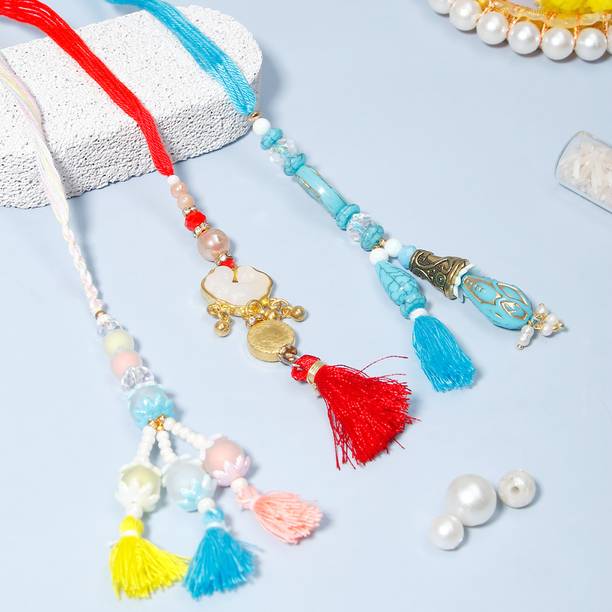 Thread Pack of 3 Premiun Charm Tassel Lumba Rakhis For Bhabhi With Greeting Card Assorted Rakhi, Greeting Card, Chawal Roli Pack Set by ARCHIES