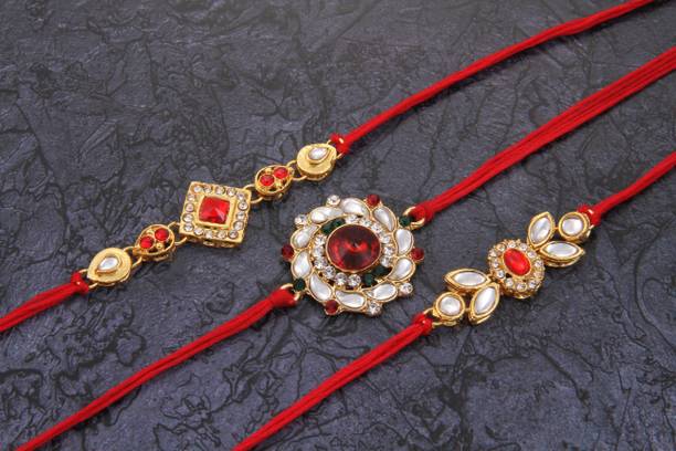 TOMUNCLE Designer Royal Gold Plated Red Rakhi Combo of 3 Rakhis Gold Finish, Kundan, Mauli Thread, Pearl Rakhi, Mug, Chawal Roli Pack, Greeting Card  Set