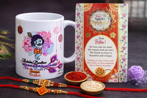 THE INDIA STYLE Religious Rakhi Gift Combo for Brother: Printed Mug, 2 Rakhis, Roli Chawal and Card Assorted Rakhi, Mug, Greeting Card, Chawal Roli Pack Set